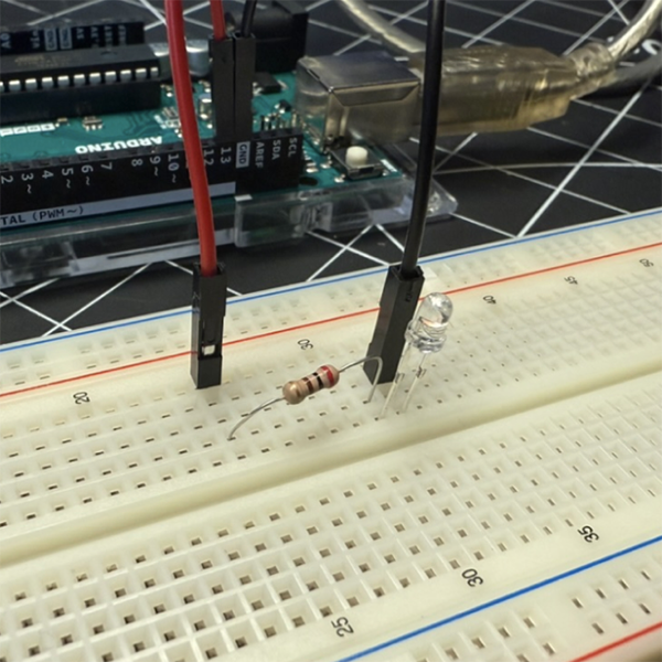 We wanted to clarify a few things about the breadboard, so we revisited our Project 1 documentation from the in-class activity. This helped us recall the positive and negative sides of the LED lights and what needs to be connected to the ground. It also refreshed our understanding of resistors.