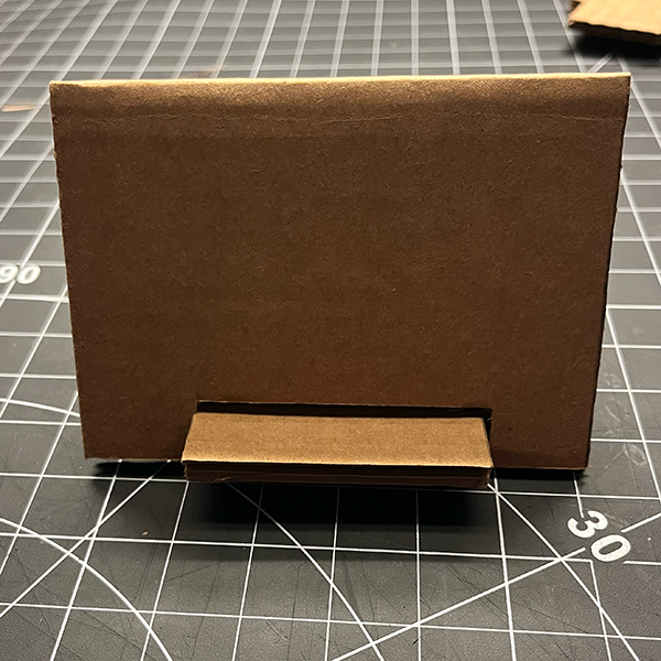 The workshop began with an introduction to guerrilla prototyping, emphasizing quick, low-fidelity methods to test ideas rapidly. We watched a video that showed us how to make a phone stand using simple materials like cardboard. We followed along, cutting and assembling our own stands while learning the importance of speed and simplicity in prototyping.